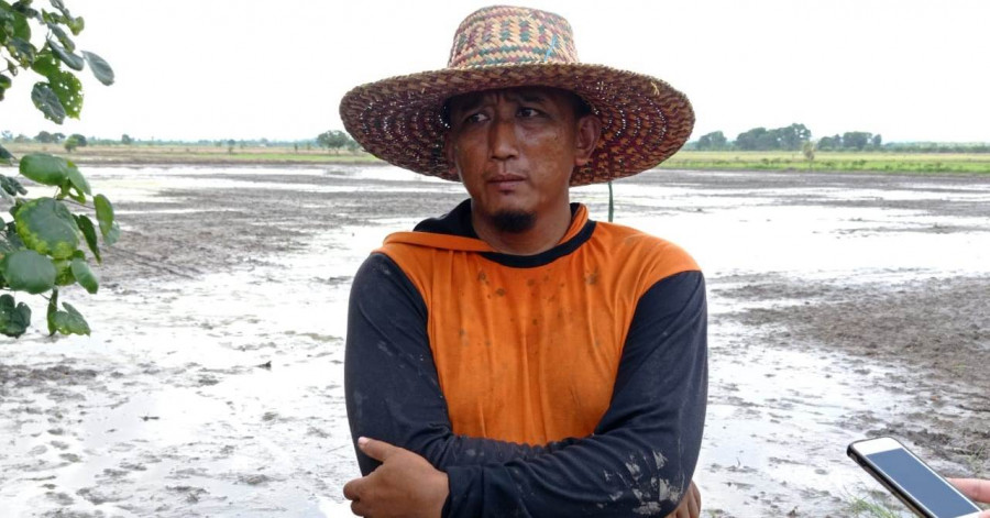 Salah satu petani di Desa Sri Raharja, Kecamatan Babulu, Kabupaten Penajam Paser Utara, Wahid. (Foto: Erwin/Korankaltim.com).