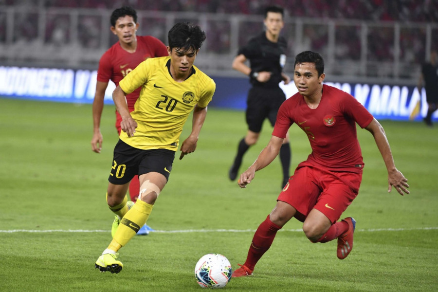 Pertandingan kualifikasi Piala Dunia 2022 antara Malaysia kontra Indonesia beberapa waktu lalu. (goal.com)