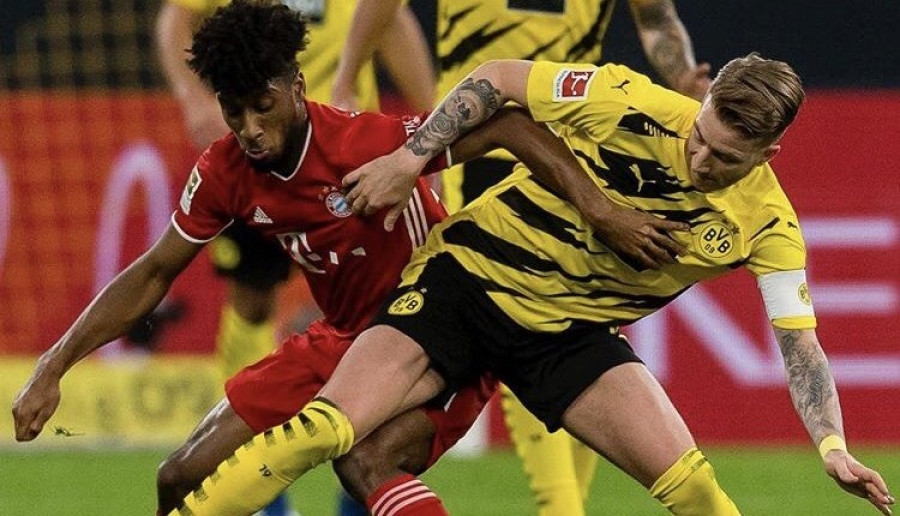Duel Borussia Dortmund kontra Bayern Munchen, berlangsung sengit di SIgnal Iduna Park. (Foto: bundesligatwitter)